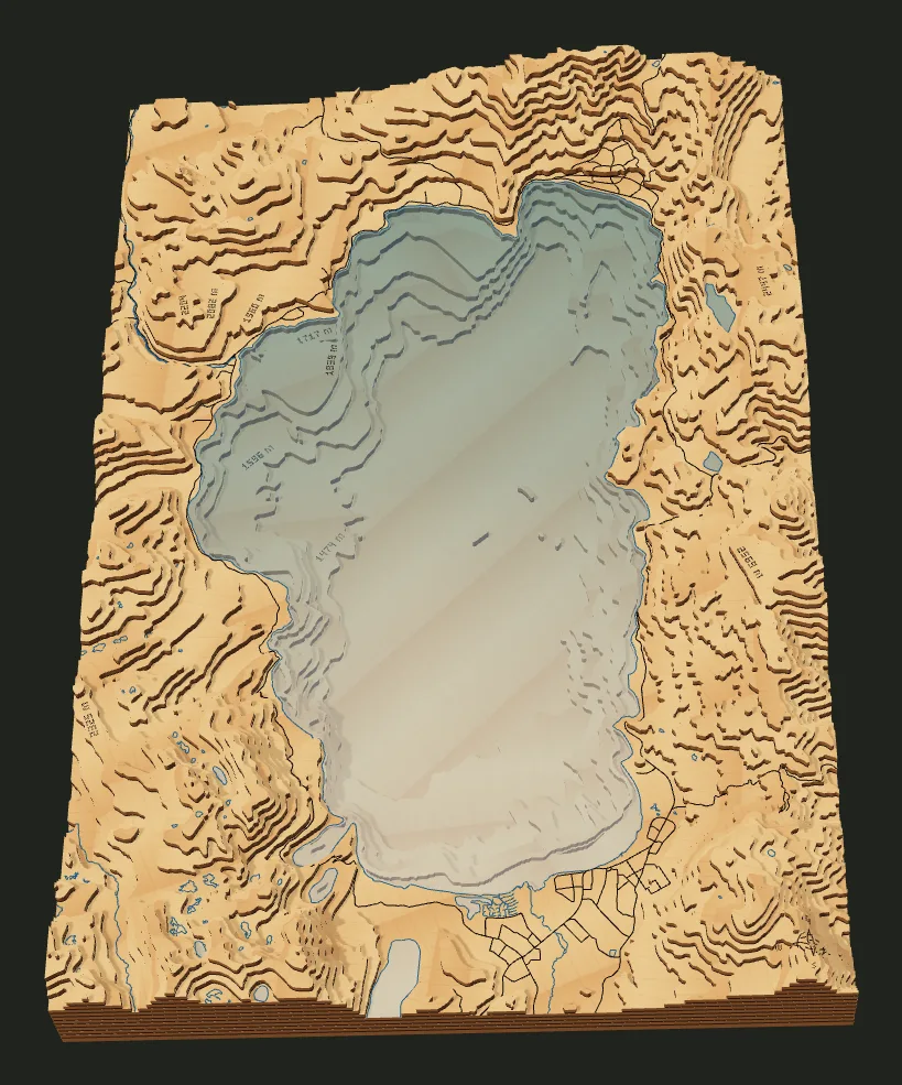 Lake Tahoe as a 14-layer laser-cut relief, rendered in the TopoStack studio.